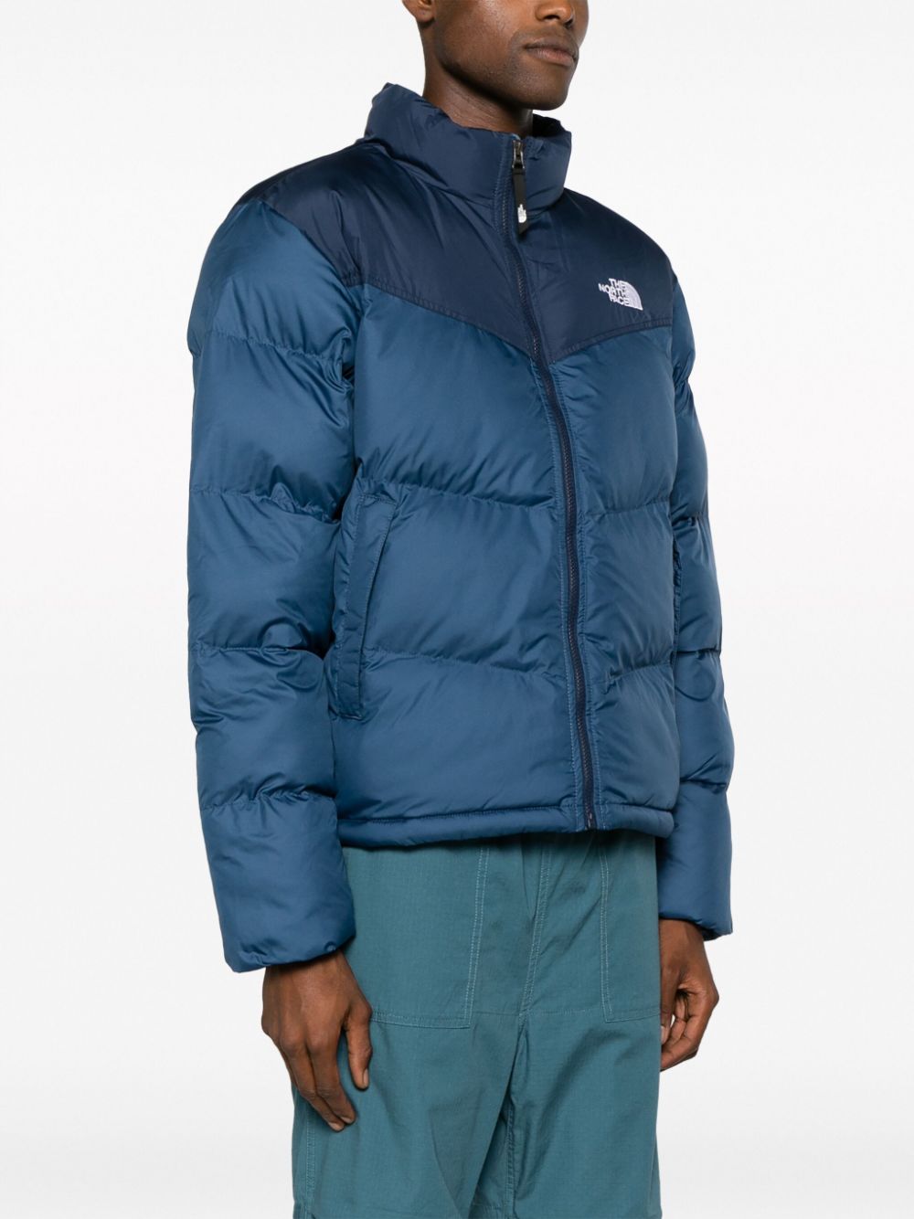 Saikuru logo-embroidered quilted jacket