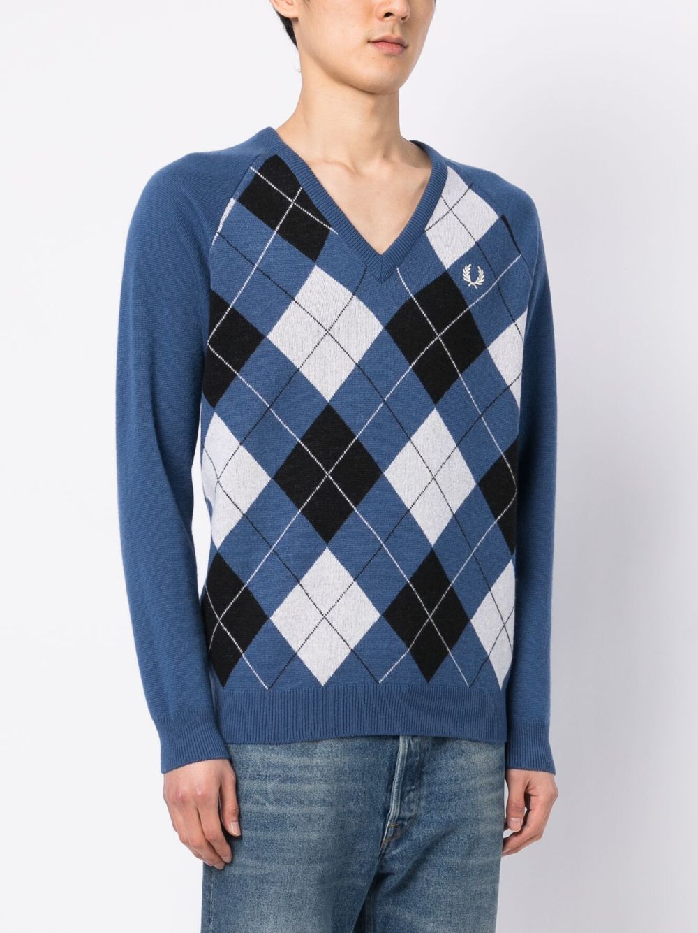 pull à carreaux avec logo brodé