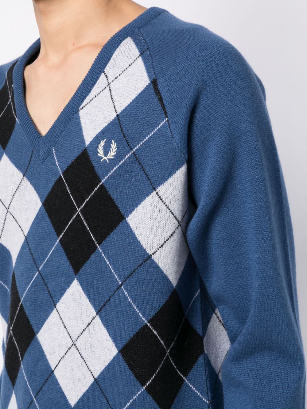 pull à carreaux avec logo brodé