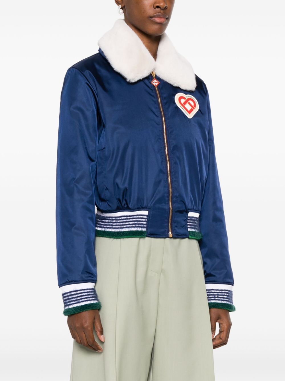 veste à col en fausse fourrure avec patch logo