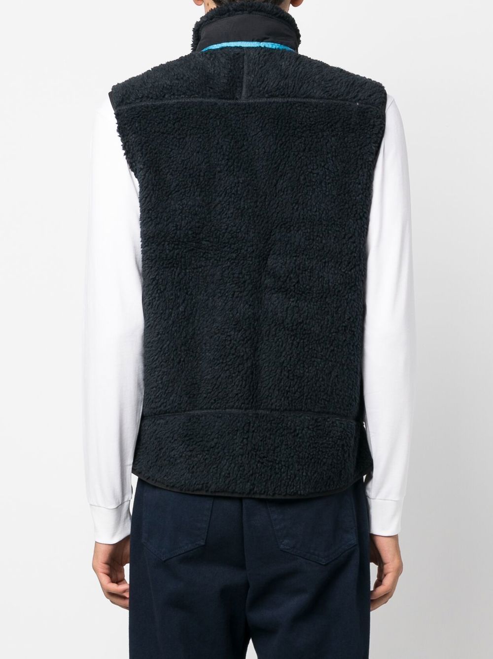 gilet en fausse peau de mouton avec patch logo