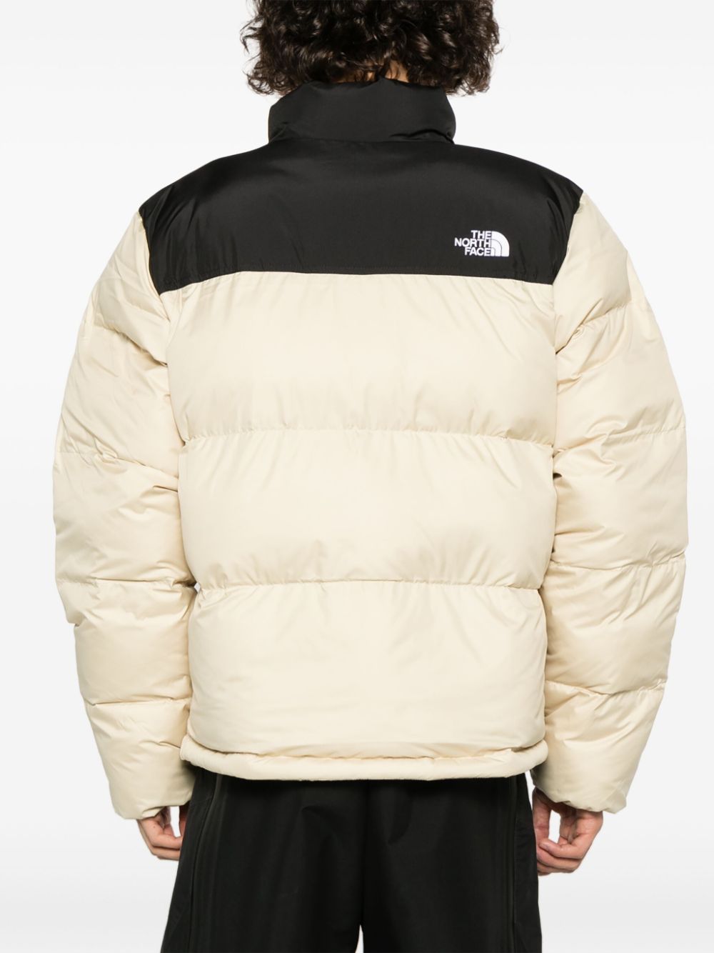 Saikuru logo-embroidered quilted jacket