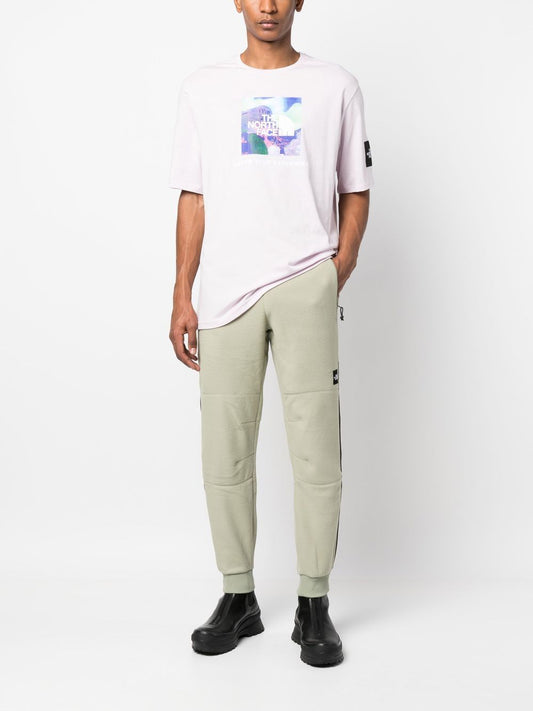 pantalon de survêtement en polaire à rayures latérales