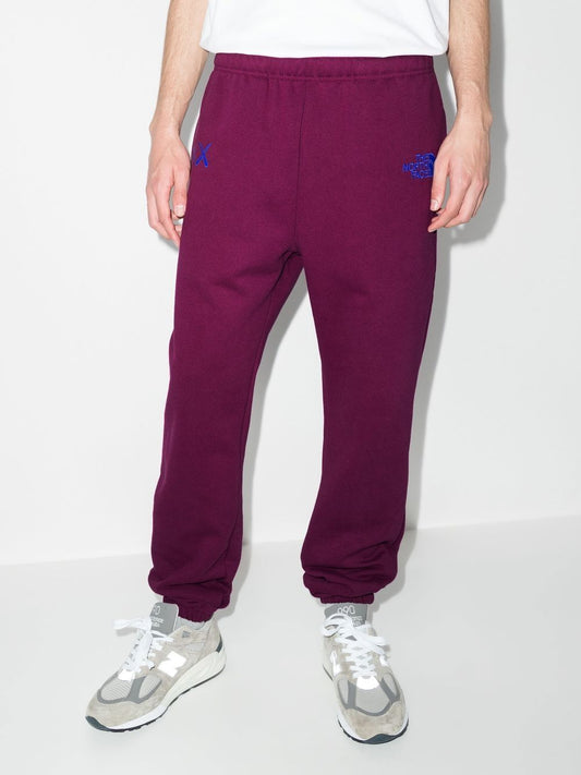 x KAWS track pants