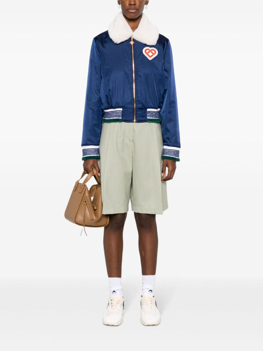 veste à col en fausse fourrure avec patch logo