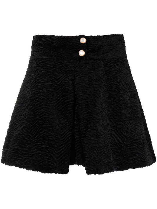 mini-jupe en velours jacquard à plis creux