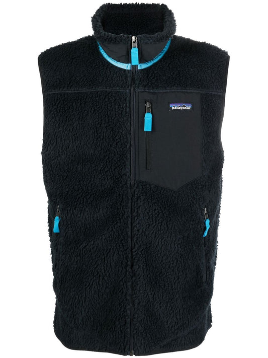 gilet en fausse peau de mouton avec patch logo